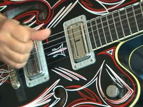 Brian Setzer on rockabilly picking using barre chords